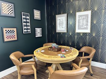 Game room with poker table and playing cards